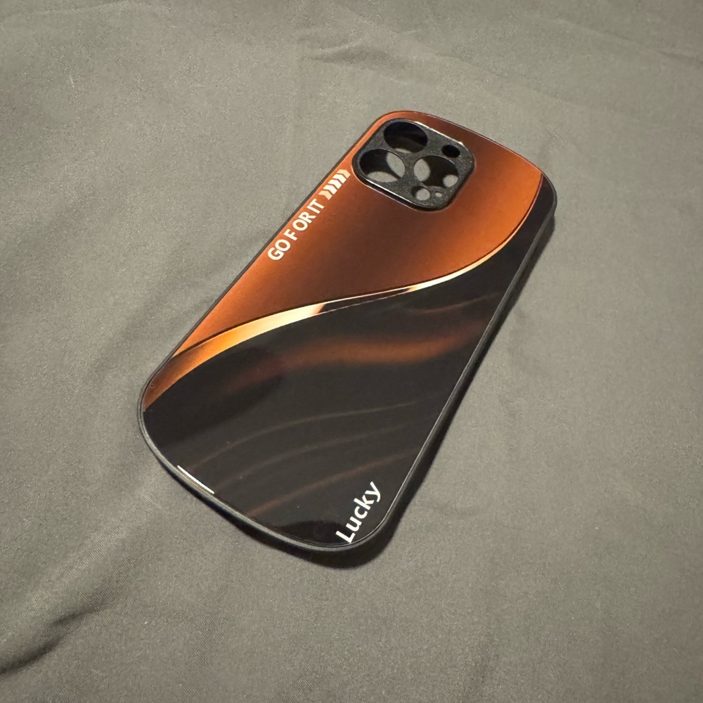 Lucky Sleek Black and Orange Case For a 15 Pro Max.